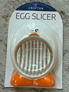Croton White Egg Slicer with Orange Accents